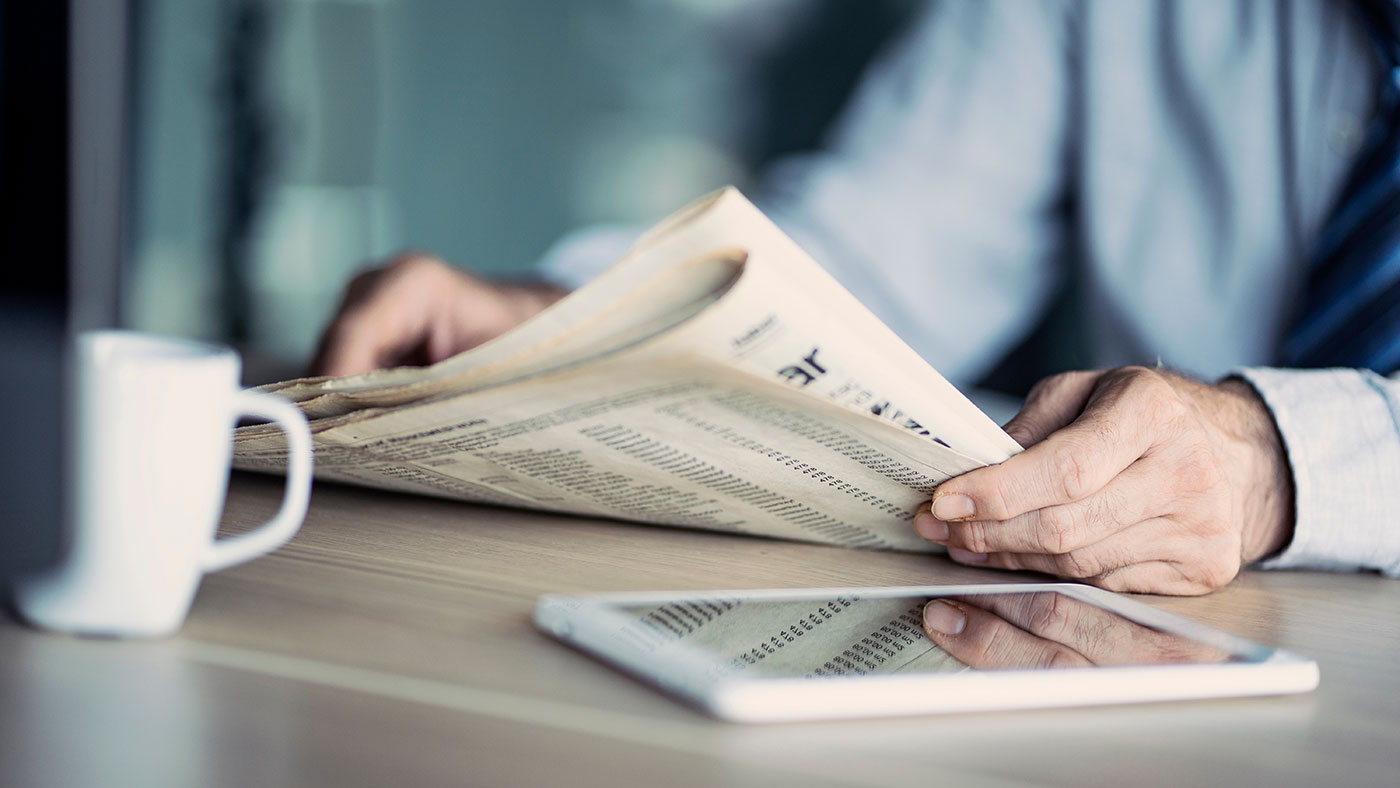 businessman reading the newspaper