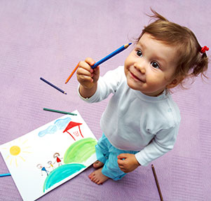 Little cute girl painting her family