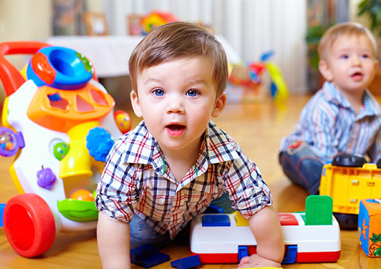 two babies playing